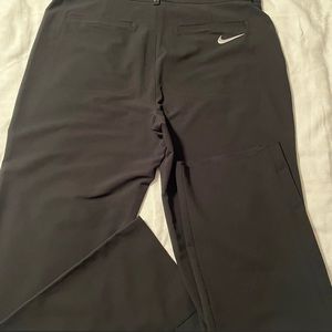 Nike Golf Tiger Woods mens standard fit pants. Color black. Size XL, waist 34.